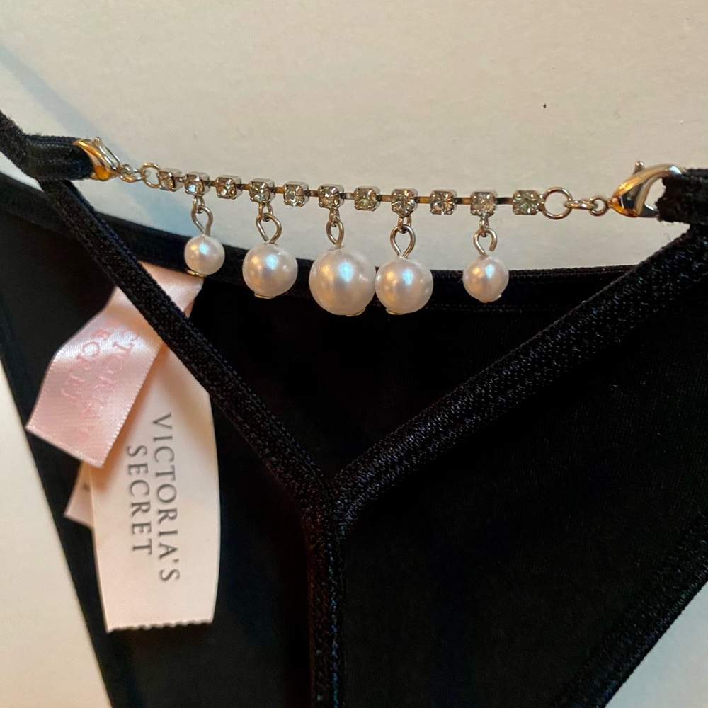 Victoria's Secret Black Thong with Pearl Accents and rhinestones.